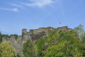 9th century medieval ruined hill castle overlooking the city La Roche-en-Ardenne in summer,