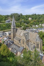 St. Nicholas Church seen from the castle ruins in the city La Roche-en-Ardenne in summer, province