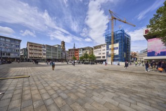 Square, general architecture, pavement slabs, construction site, scaffolding, crane, pedestrians as