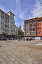 Square, general architecture, pavement slabs, trees, steeple of the collegiate church Stuttgart,