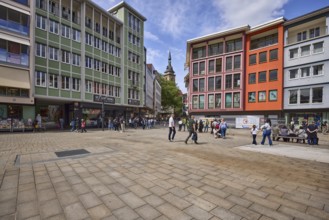 Square, general architecture, pavement slabs, trees, steeple of the collegiate church Stuttgart,