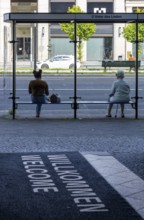 Glass bus shelter at a bus stop Unter den Linden, Berlin, Germany