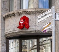 Red pharmacy symbol, former Mohrenstraße, Berlin, Germany