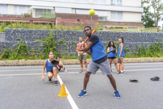 Baseball player swings the bat, preparing to hit the ball during a training session, while