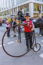A penny-farthing rider with top hat, Oktoberfest, Munich, Upper Bavaria, Bavaria, Germany