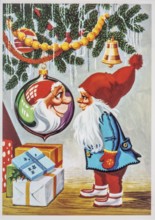 Old Christmas greeting card. Santa Claus is reflected in a Christmas tree decoration