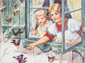 Old Christmas greeting card. Two girls at open window feeding small birds in the snow
