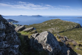 View over rocky mountain and coastal landscape, offshore islands in the background, Otroya or