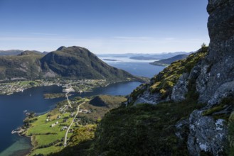 Expansive coastal landscape with mountains, sea and the village of Midsund, Otroya or Otrøya