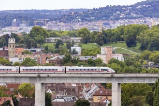 Deutsche Bahn AG ICE train travelling on the Schusterbahn, Münster viaduct with city view of Bad