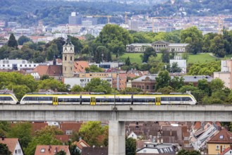 SWEG regional train travelling on the Schusterbahn, Münster viaduct with Bad Cannstatt and