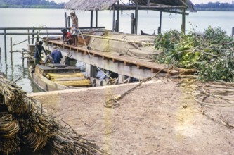 Coastal village loading boats, Singapore and Johor Bahru, Malaysia, Southeast Asia 1964