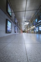 Perspective of a corridor in an empty underground station with tiled floor, Münchner Freiheit,