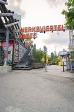 Entrance to creative urban area with eye-catching architecture and graffiti, Werksviertel Munich,