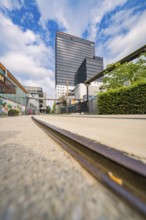Urban scene with low view of railway tracks and modern buildings, Werksviertel Munich, Munich,