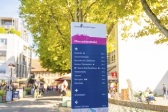 Signposts in an urban environment, destinations and distances, sunny and lively, Sindelfingen,