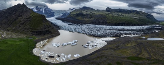 Glacier, glacier tongue, glacier lake, mountains, cloudy, aerial view, panorama, summer,
