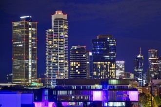 Rooftop day with colourfully illuminated houses for a techno party on the roof with a view of the