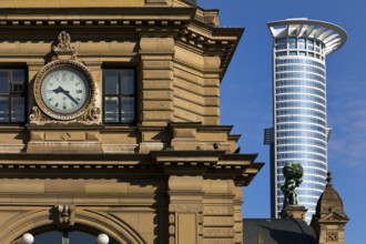 Side front of the main railway station with Atlas carrying the globe on his shoulders in front of