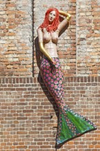 Mermaid, mermaid, figure on brick wall, warehouse, Neue Semlower Straße, harbour island, old town,
