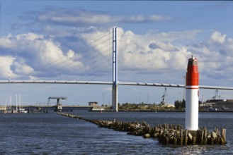 In front sea mark, beacon, harbour entrance, behind it Rügen bridge, connects island Rügen with