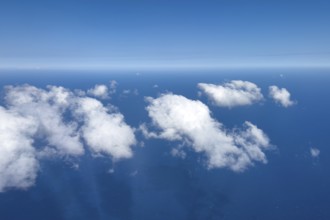 Aerial view from 11000 metres 36, 000 ft feet altitude on white cirrocumulus high cumulus clouds,