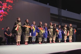A Kurdish traditional dance troupe performs during the Damascus International Fair, the first