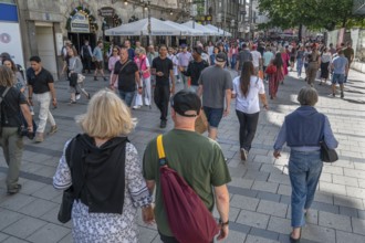 Strolling tourists in the pedestrian zone, Neuhauser Str, Munich, Bavaria, Germany