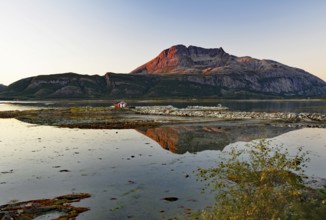Fjord landscape with lake during sunset, reflected in calm water, Offersöy, Kystriksveien,