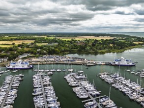Wight Light car ferry to Isle of Wight on Lymington River and marina from drone, Lymington, New