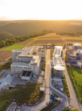 Compact aerial view of a modern building complex at sunset, new hospital building, Calw health