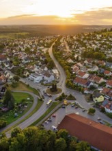 Urban settlement with red roofs and winding streets in the setting sun, small town pearl Calw,