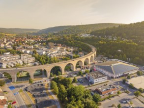Town view with dominating viaduct running through an urban and natural landscape, small town pearl