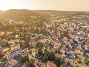 Panoramic view over a town in sunshine with visible church and historic buildings, small town pearl