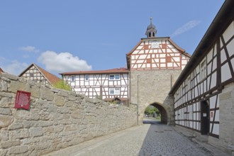 Historic Lower Tor with spire and clock and half-timbered houses, Tor tor, town gate, town wall,