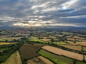 Sunset of Fields and Farms over Devon from drone, Torquay, Torbay, Devon, England, United Kingdom