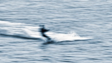 Kitesurfer in the surf, wiping effect, long exposure, Sankt Peter-Ording, Eiderstedt peninsula,