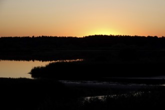 Landscape with lake, rising sun, August, Saxony, Germany