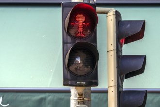 Pumuckel figure in a pedestrian traffic light, Munich, Bavaria, Germany