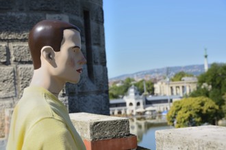 Mannequin enjoys the panoramic view of budapest from the historical buda castle, showcasing the