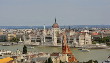 Panoramic view of the hungarian parliament building on the danube river in budapest, hungary,