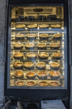 Rows of traditional turkish cheesecakes, called san sebastian cheesecakes, are displayed in a