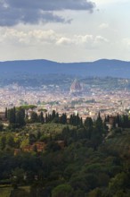 Panoramic view of the city of Florence with dome amidst Tuscan hills in Italy