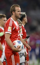 Harry Kane FC Bayern Munich FCB (09) satisfied with match ball after the end of the game Allianz