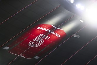 Larger-than-life jersey of Emperor Franz Beckenbauer with shirt number 5 hangs in the grandstand