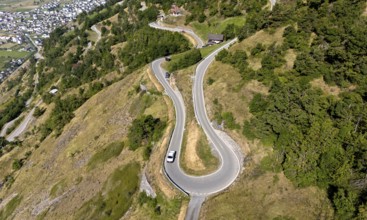 Narrow mountain road to Hohtenn railway station above the Rhone Valley, Valais, Switzerland