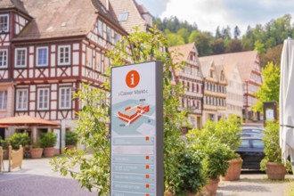 Information board about the Calw market with picturesque half-timbered houses in the background,