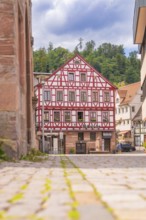 Historic half-timbered house in a cobbled street with picturesque architecture, small town pearl