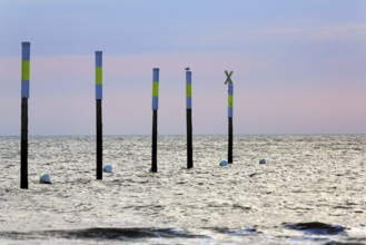 Five poles in a row, marker, sea mark, buoys, evening sky, Sankt Peter-Ording, Eiderstedt