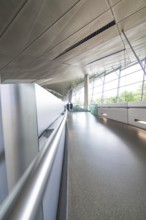 Long corridor with glass walls, deserted, futuristic atmosphere, BMW Welt, Munich, Germany